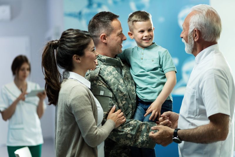 happy-senior-doctor-talking-little-boy-who-cam.jpg