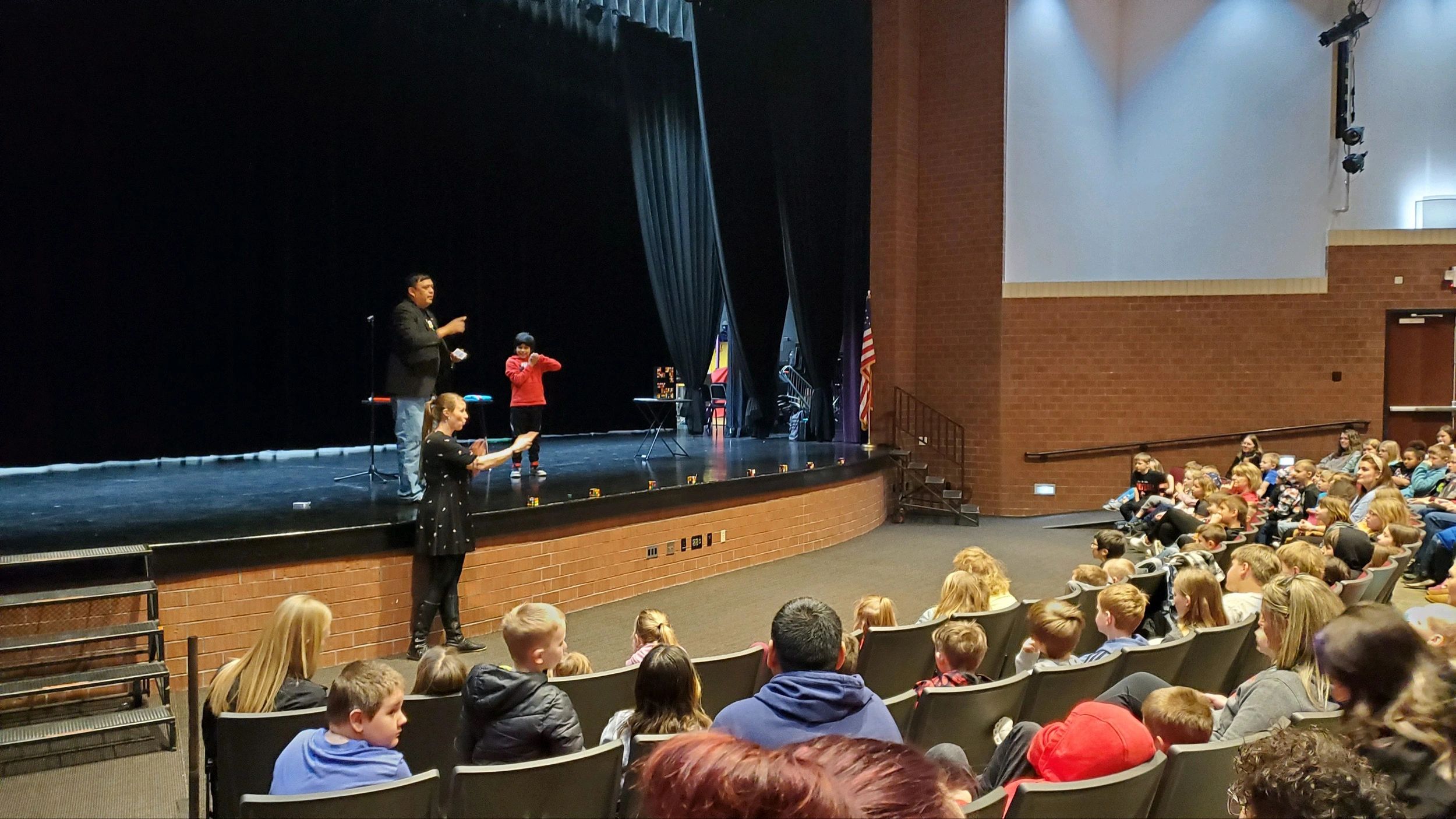 Brian Yazzie on stage with audience