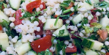 Fresh vegan Israeli salad with pearl couscous, cucumbers, parsley and tomatoes! Easy to make