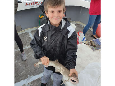 Our youngest Son Ethan all proud of his Dog Fish