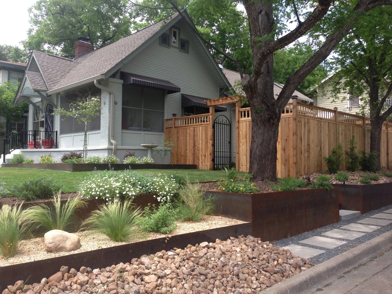 Charming house with a well-maintained garden and modern landscaping features.