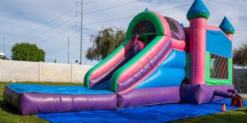 Blue pink and green water slide and bounce house combo inflatable for kids, teens and adults. 