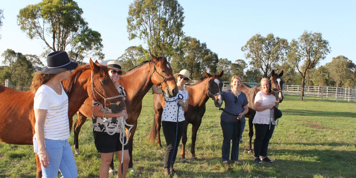 Ladies from our Women's Group smiling from their day of connecting and learning through horse therapy.