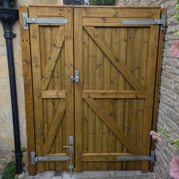 Custom built double gate with secure code lock installed for security.
