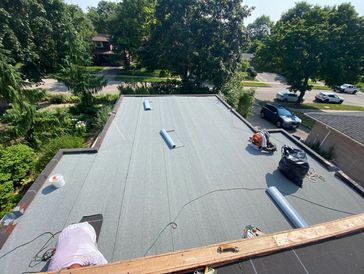 Professional install of a modern residential Flat Roof Mod-Bit membrane system. Durable & watertight