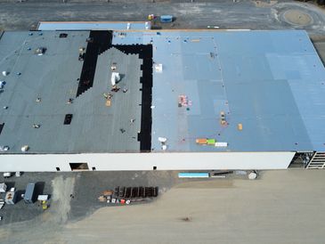 Commercial torch down mechanically fastened modified bitumen flat roof, durable and professional.