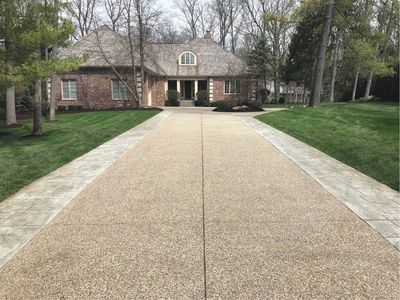 Aggregate concrete driveway installation in Des Moines, Iowa. 