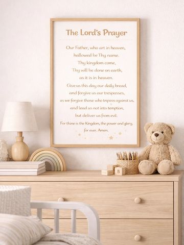 Cozy nursery corner with The Lord's Prayer framed on the wall.