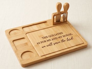 Wooden cutting board with knives and an inspirational quote.