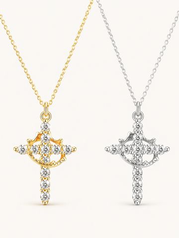 Two cross-shaped pendants with diamonds, one gold and one silver.