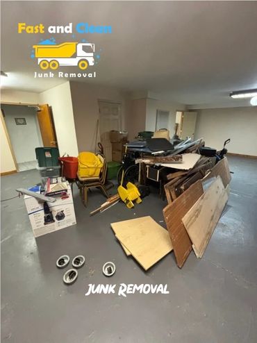 A room filled with various junk items ready for removal.