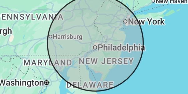 Map highlighting a circular region around Philadelphia covering parts of Pennsylvania, New Jersey, and Delaware.