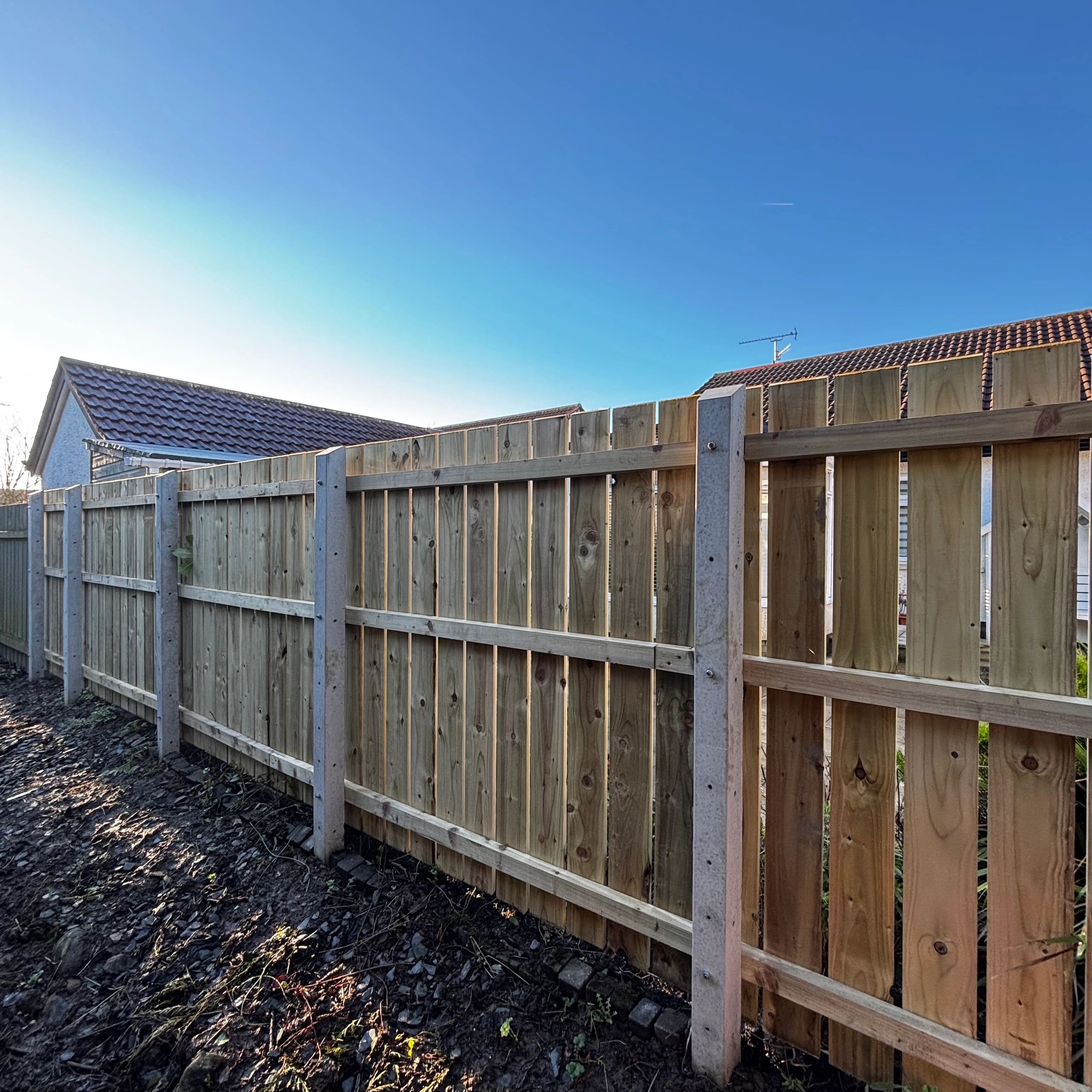 new wooden fence expertly built using concrete posts in Coleraine 
