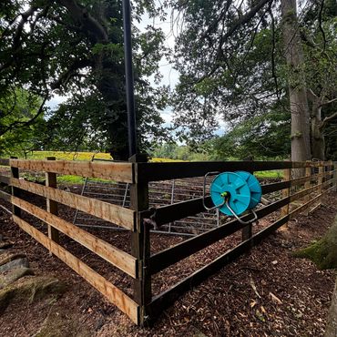 post and rail fence rebuilt after storm damage