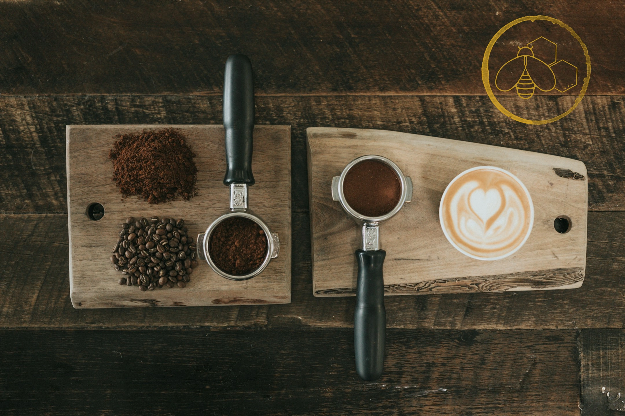 A charcuterie board: coffee grounds, portafilters, and a heart latte. A bee in a ring of coffee. 