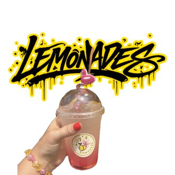 Hand holding a lemonade with a flamingo straw and colorful bracelet.