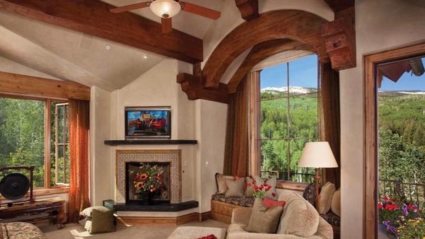 A custom mountain home designed by an Aspen architect. The cozy master bedroom elevates custom homes