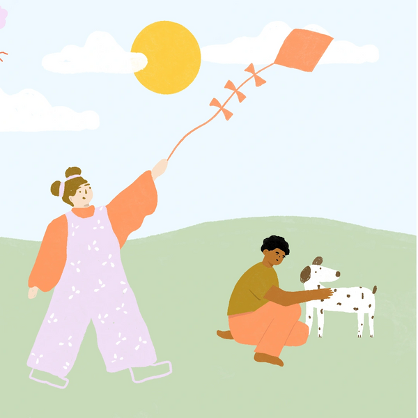 Child flying a kite and another child patting a spotted dog. Pascoe Vale occupational therapy