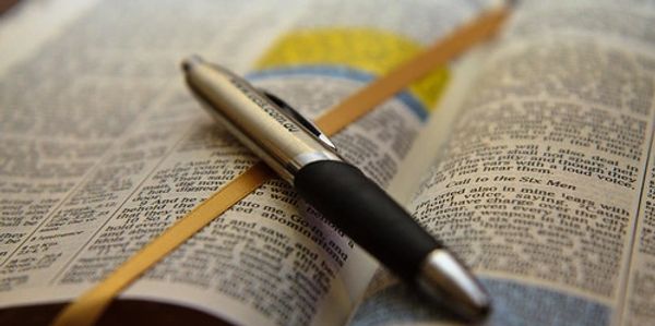 Bible with highlighted text symbolizing guidance, reflection, and spiritual direction
