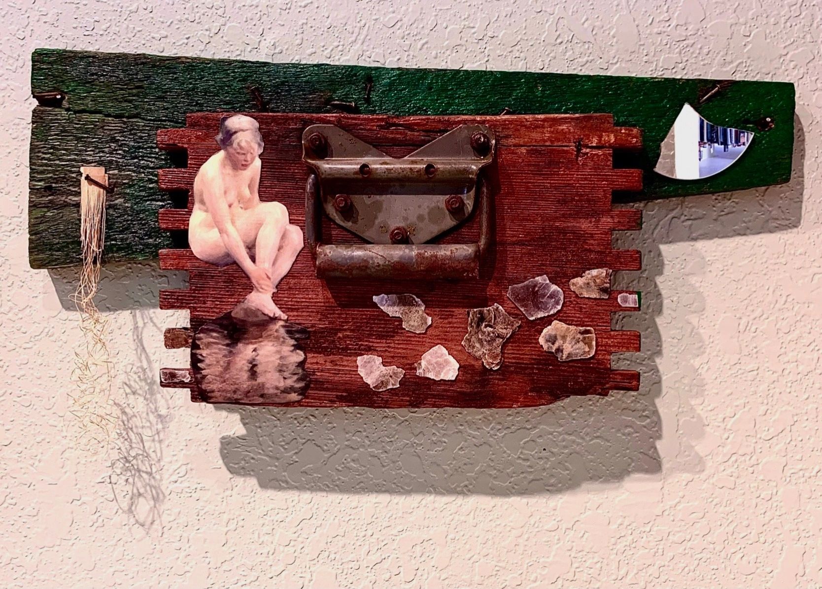 Reflective elements: mica, mirror and figure. Attached to front of old drawer with handle. 