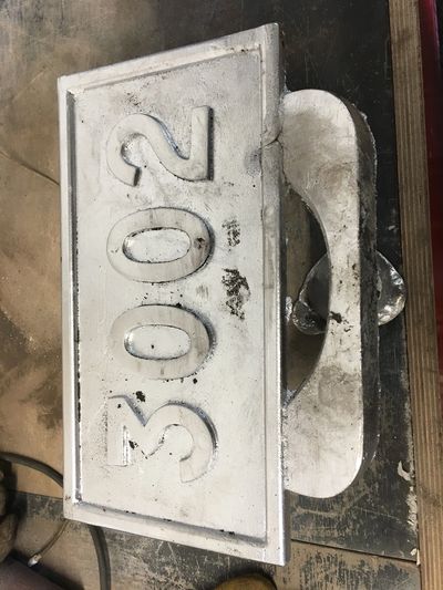 Mold for a number plate
