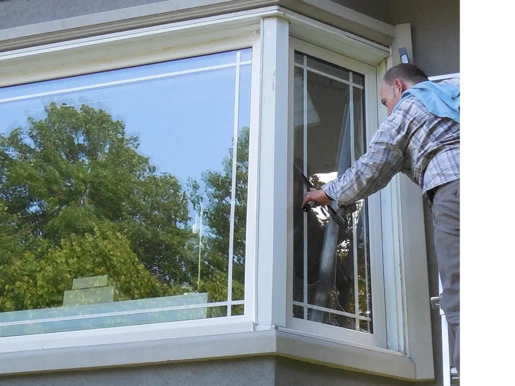 Exterior window being squeegeed clean 