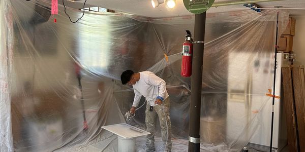 Putting some 2k Centurion finish on cabinet doors
