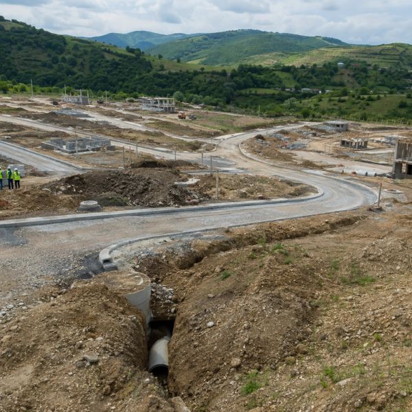 Construction site with roads and drainage pipes.