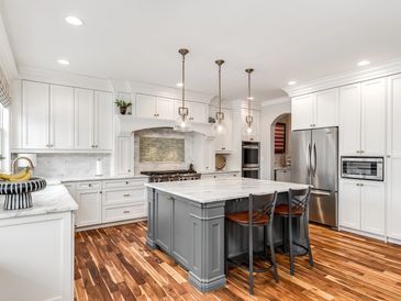 Custom white and gray Shaker style cabinets