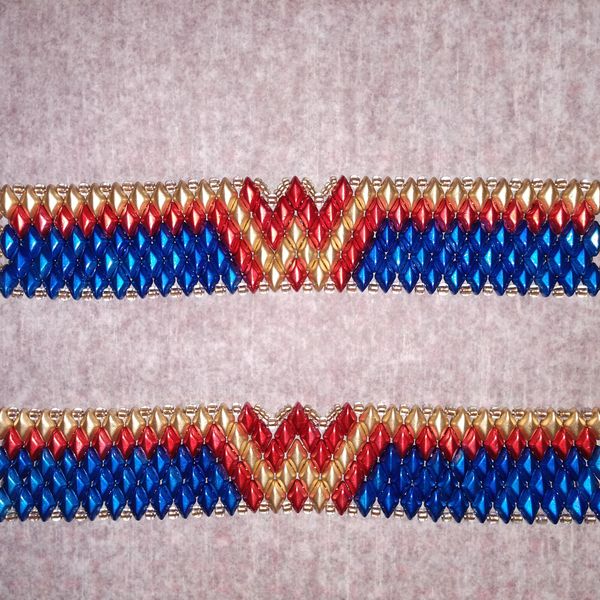 Two beaded bracelets with wonder woman logo 