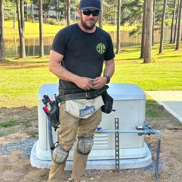 robbie in front of an ev charger