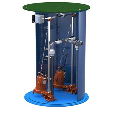 Submersible pump setup inside a cylindrical chamber with pipes and control mechanisms.