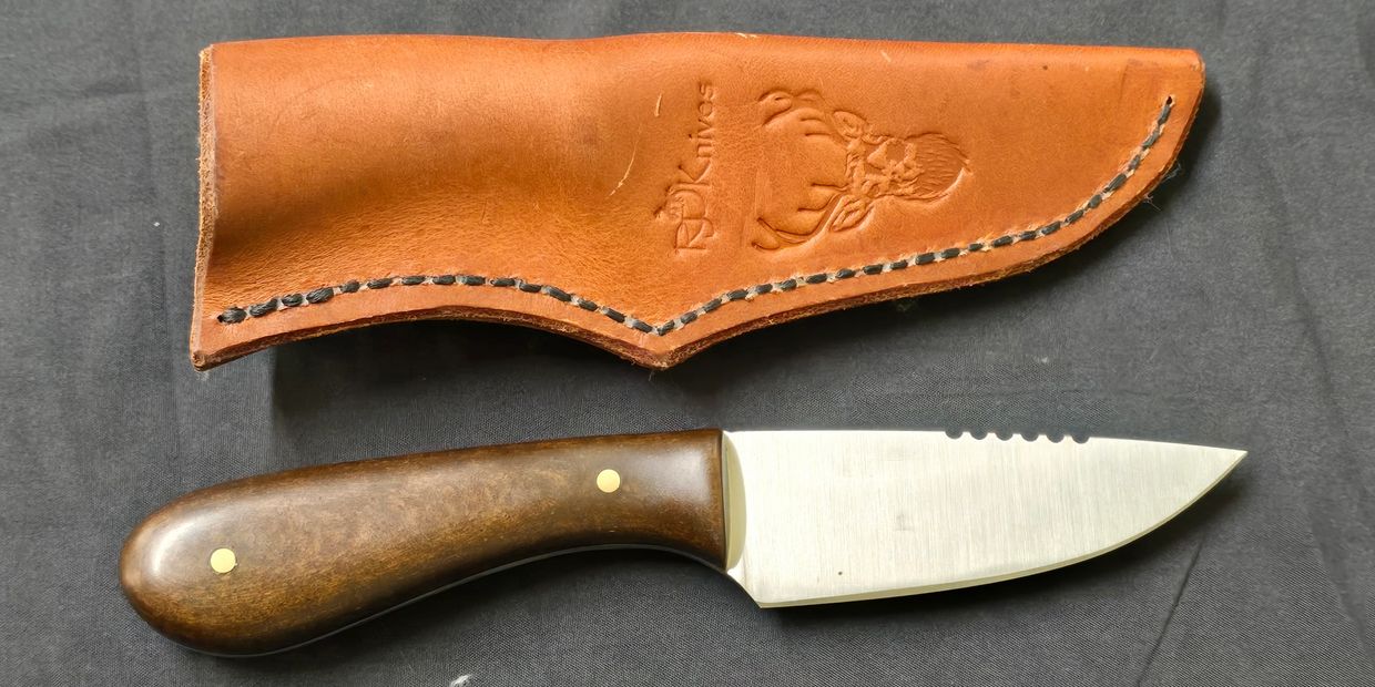 3 inch scout knife with a leather sheath