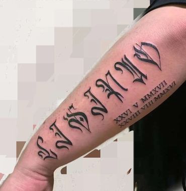 Custom script lettering tattoo on forearm by Amber Tattoos Ajax ON