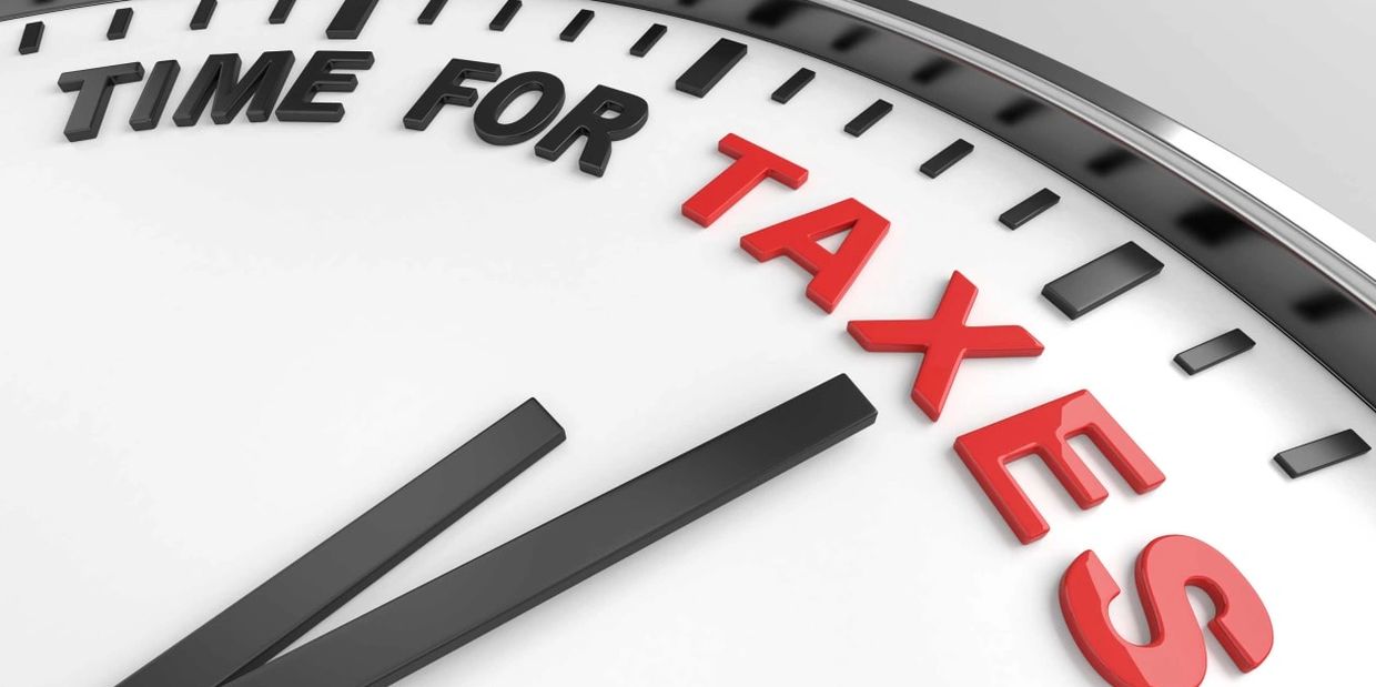 Clock with the phrase 'TIME FOR TAXES' highlighted.