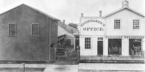 Historic black and white photo of Studebaker's office and carriage repository.
