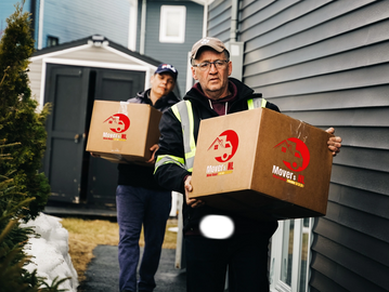 Image of Movers NL team members carrying boxes