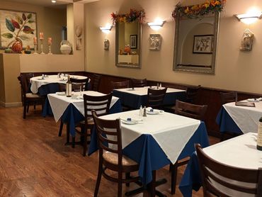 Cozy restaurant dining area with neatly set tables.