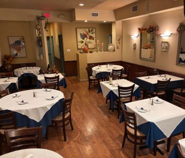 Cozy restaurant dining area with neatly set tables.