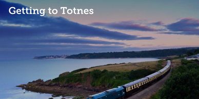 A scenic train journey along the coast to Totnes at sunset.