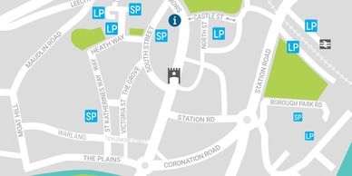 Map showing streets and parking spots near a castle symbol.