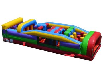 Colorful inflatable obstacle course with various shapes and sections for climbing and jumping.