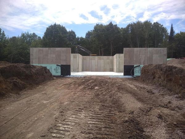 A view of an expansive concrete foundation project, showcasing precision sitework 