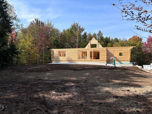 A front-side view of a completed foundation wall with foam board insulation in place