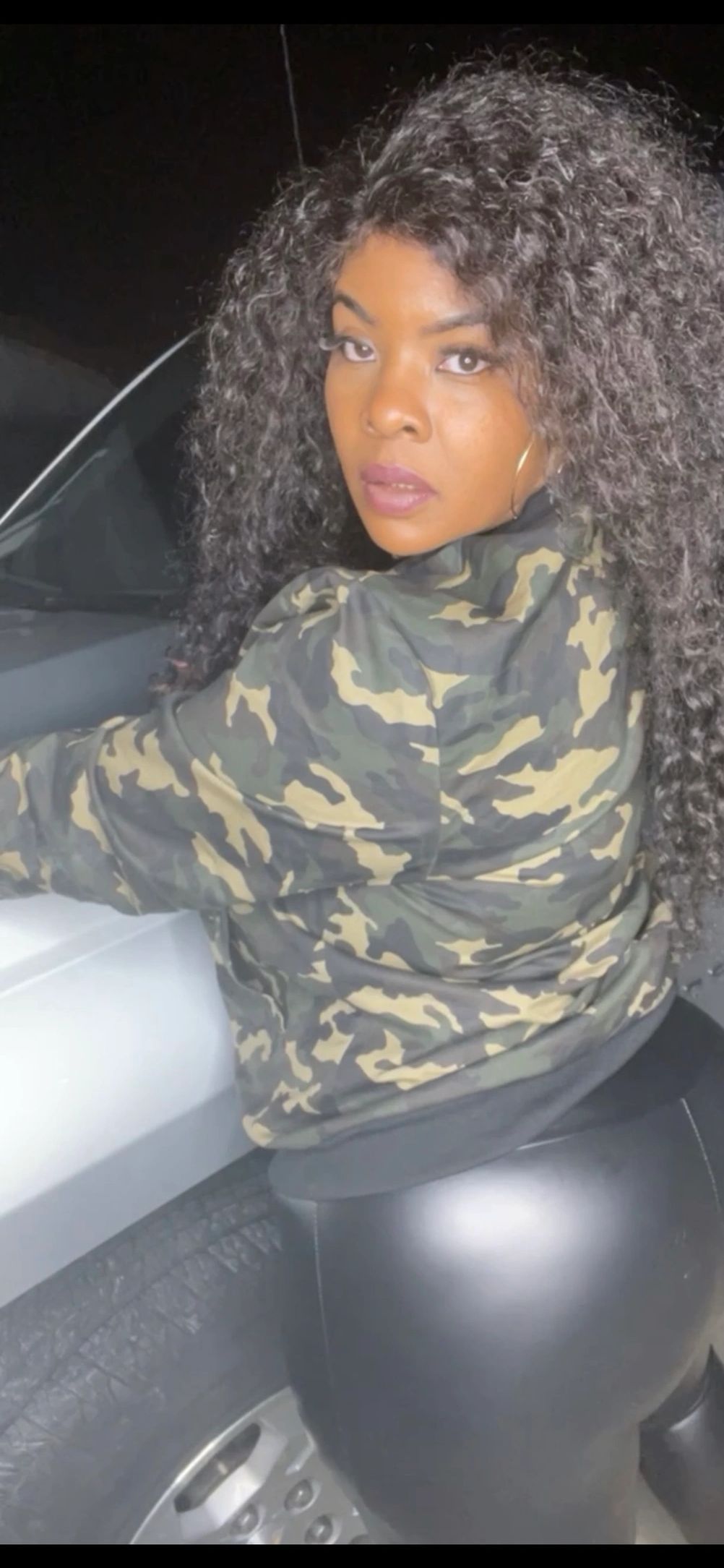 DreamCarQueen 2021 poses in front of her fully loaded Silverado Crew Cab