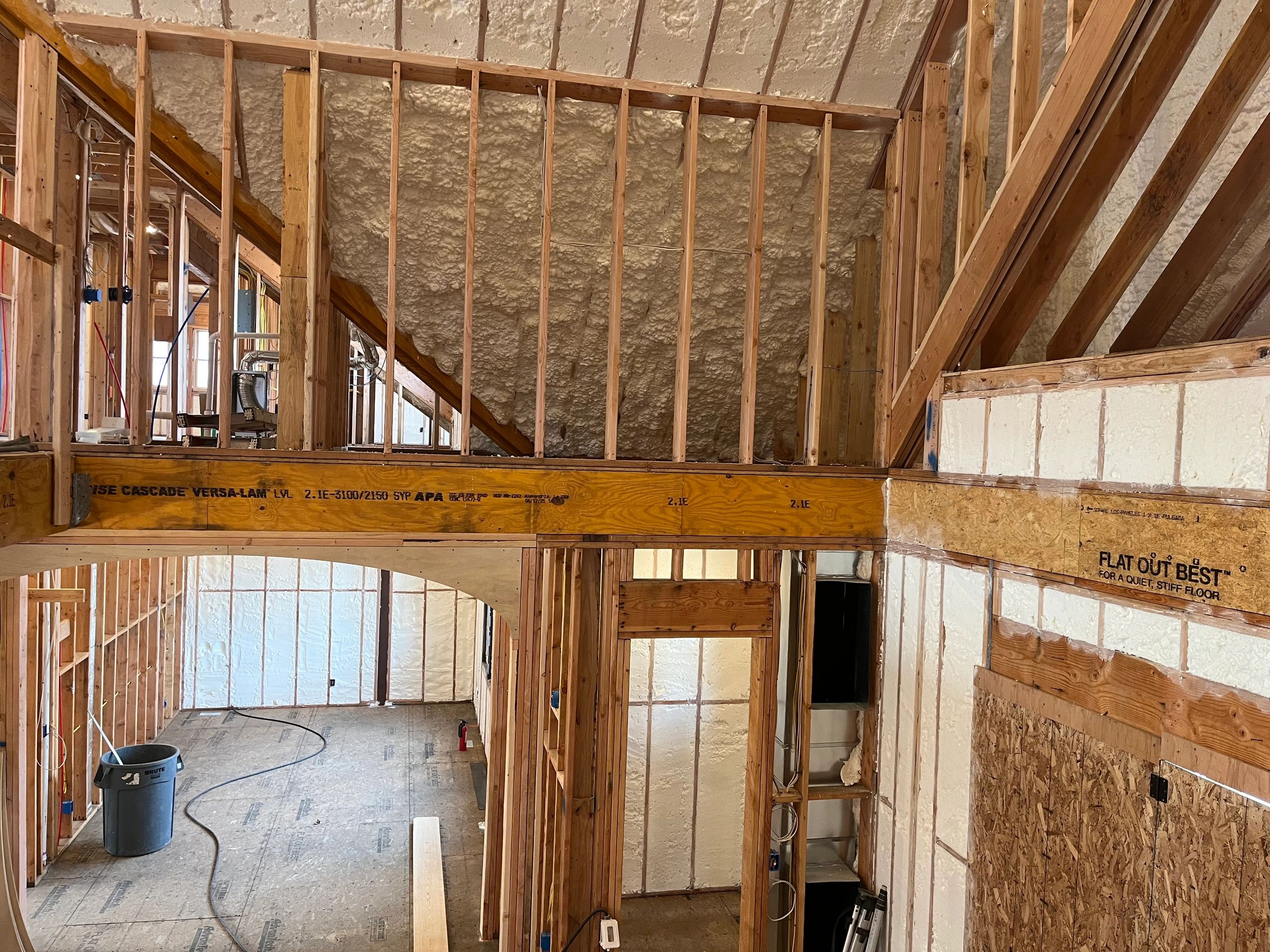 Insulated wooden frame construction inside a building.