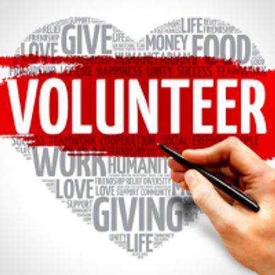 The heart shape fills with words; love, give, work, foo, and humanity, with the word volunteer very 