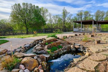 Professional real estate photographer in Elk City, OK took this photo of a backyard koi pond.