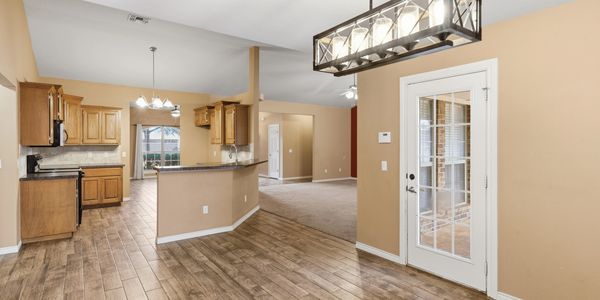 Bright open-plan kitchen and living area photographed for a residential listing near Elk City, Oklah