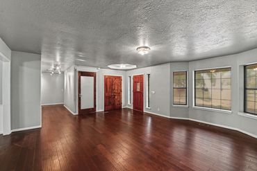 Real estate photographer in western Oklahoma took this photo of a living room with hardwood floors